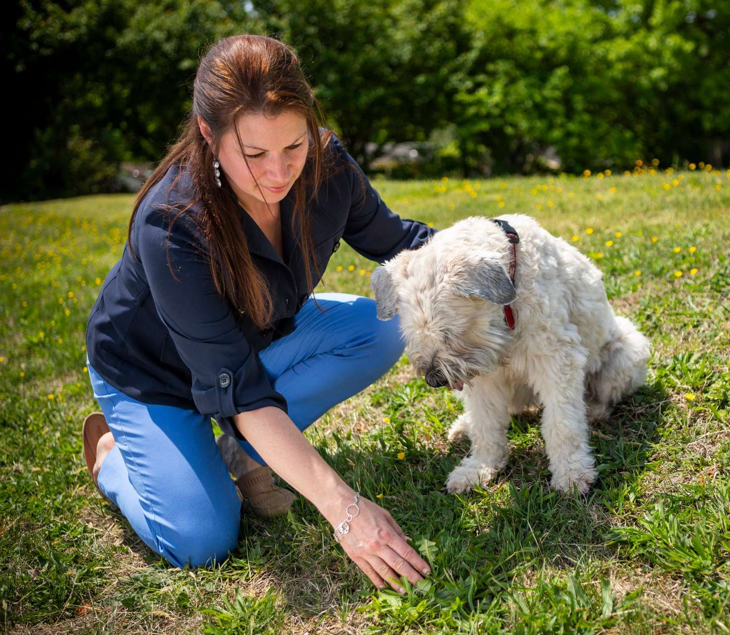 Customer examining her lawn issue