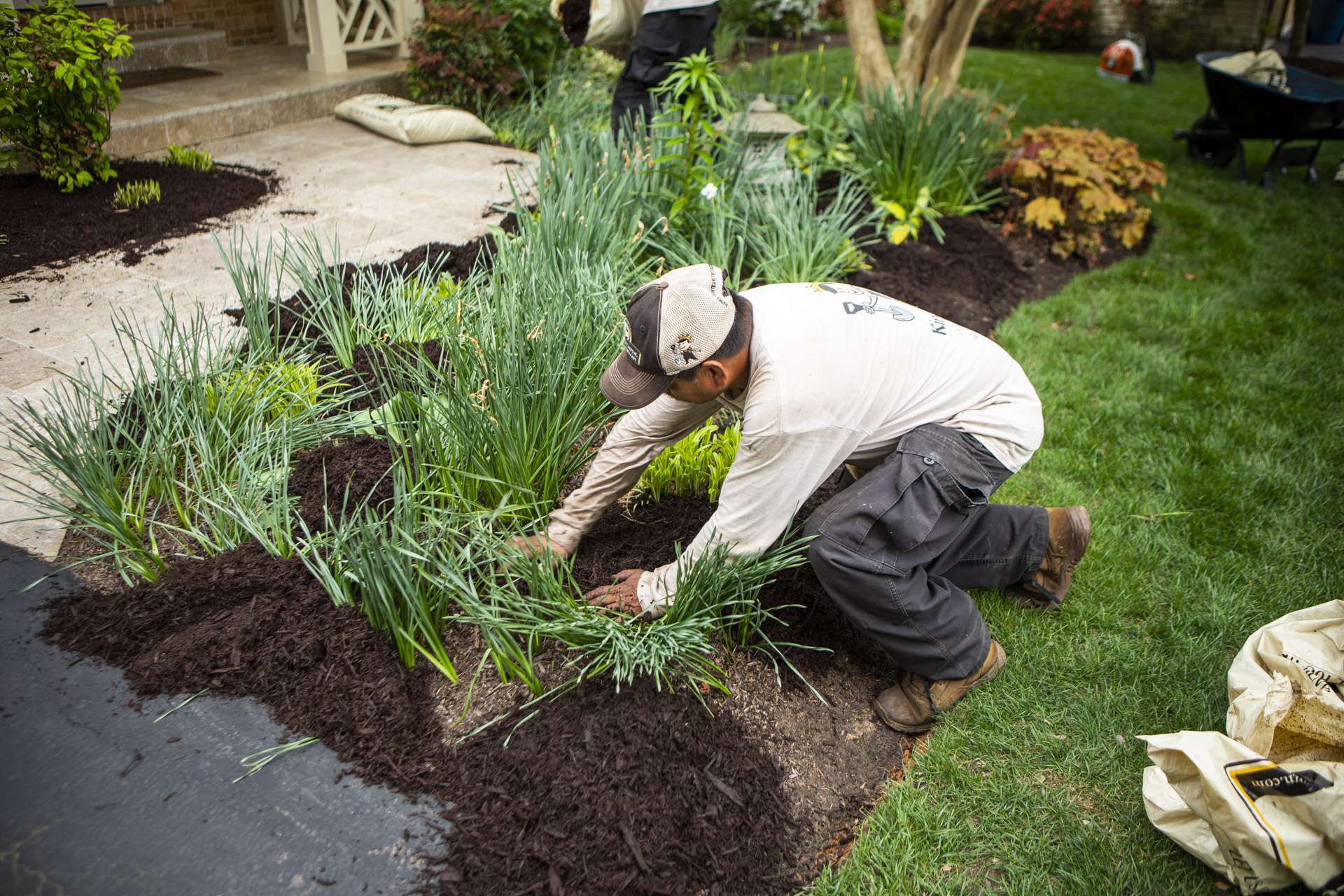 landscape maintenance technician mulching 