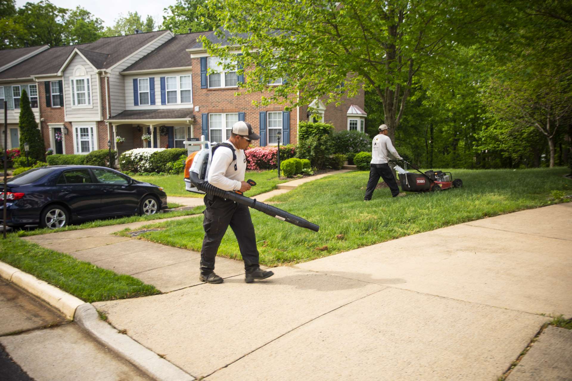 Lawn care team cleaning up