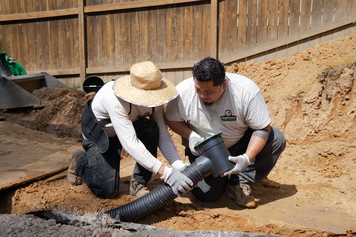 landscape team installs drainage