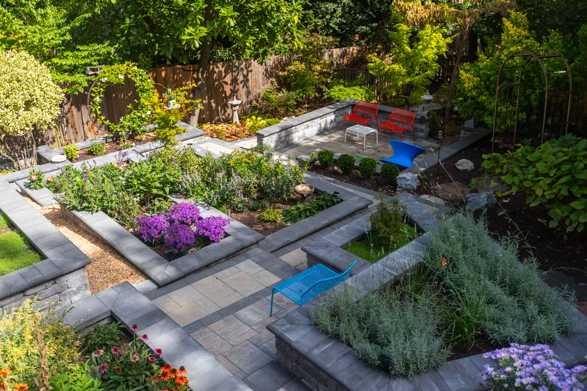 nice overhead view small backyard hardscapes walkways plantings fence shade trees 2