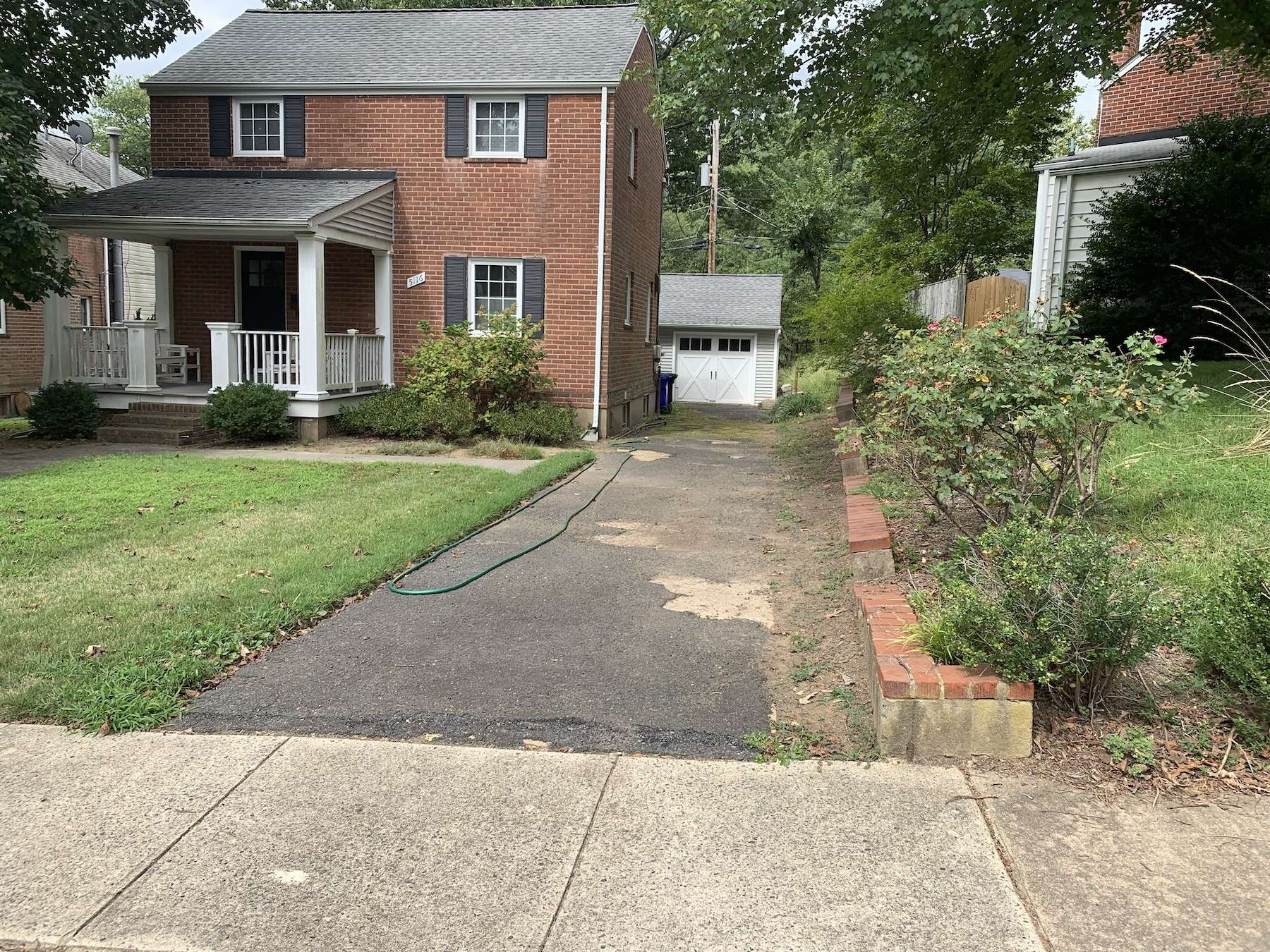 arlington va landscaping project before image before driveway, retaining wall and front porch