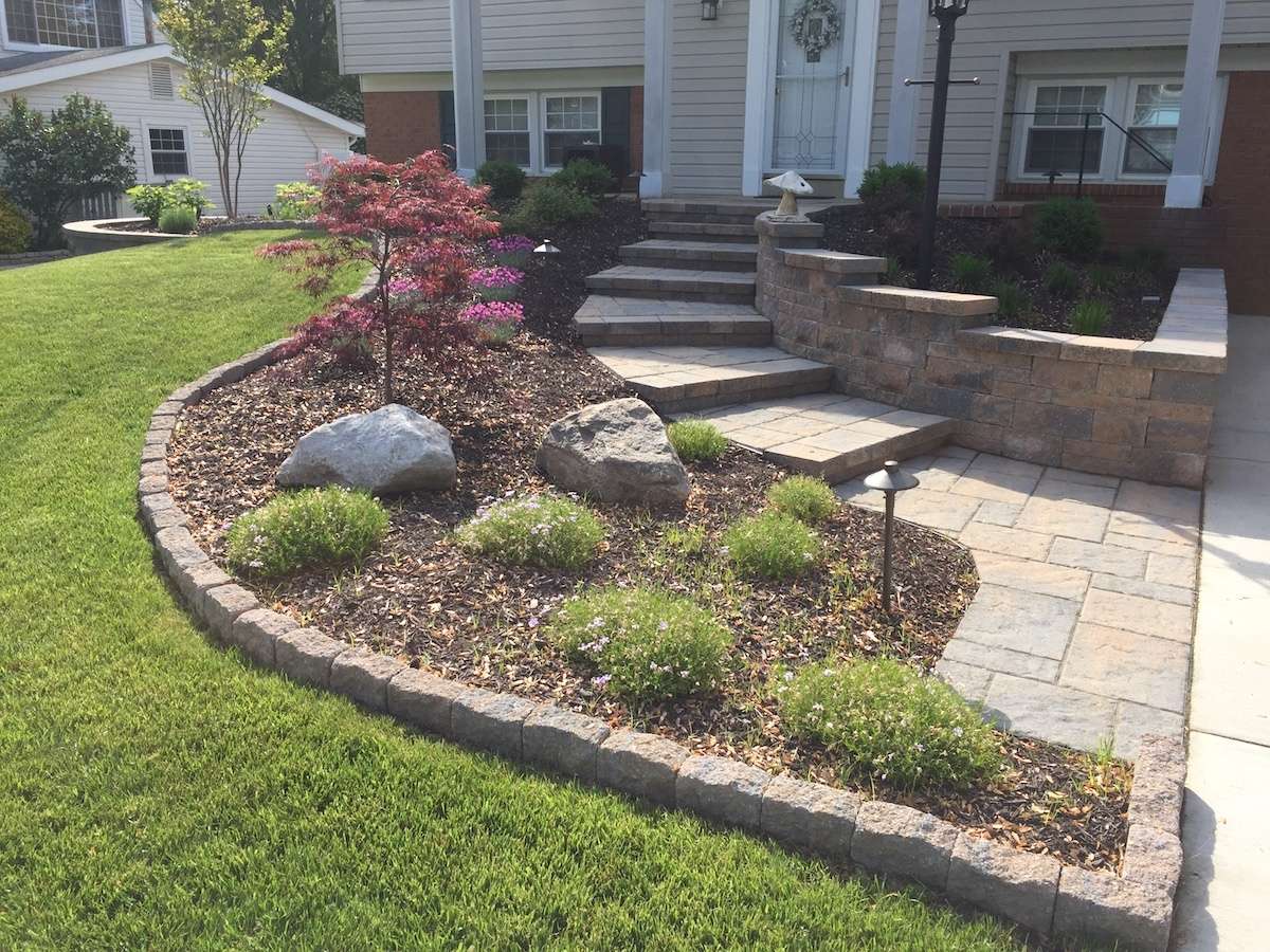 plant bed with edging in front yard landscape