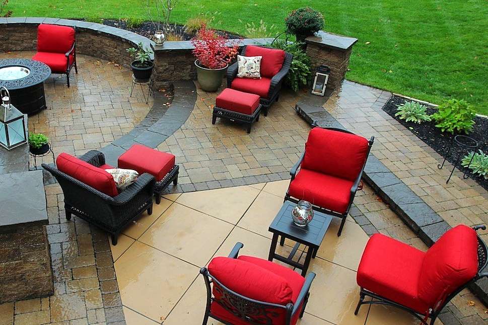 Large paver patio with furniture and fire pit