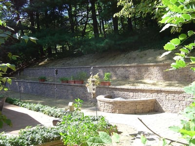 sloped yard with retaining wall and terrace in Virginia