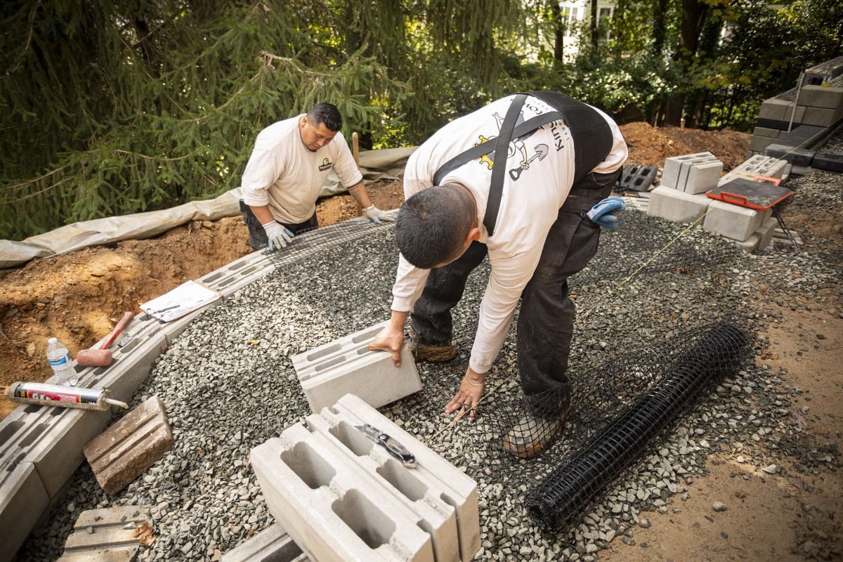 landscape installation team build retention wall