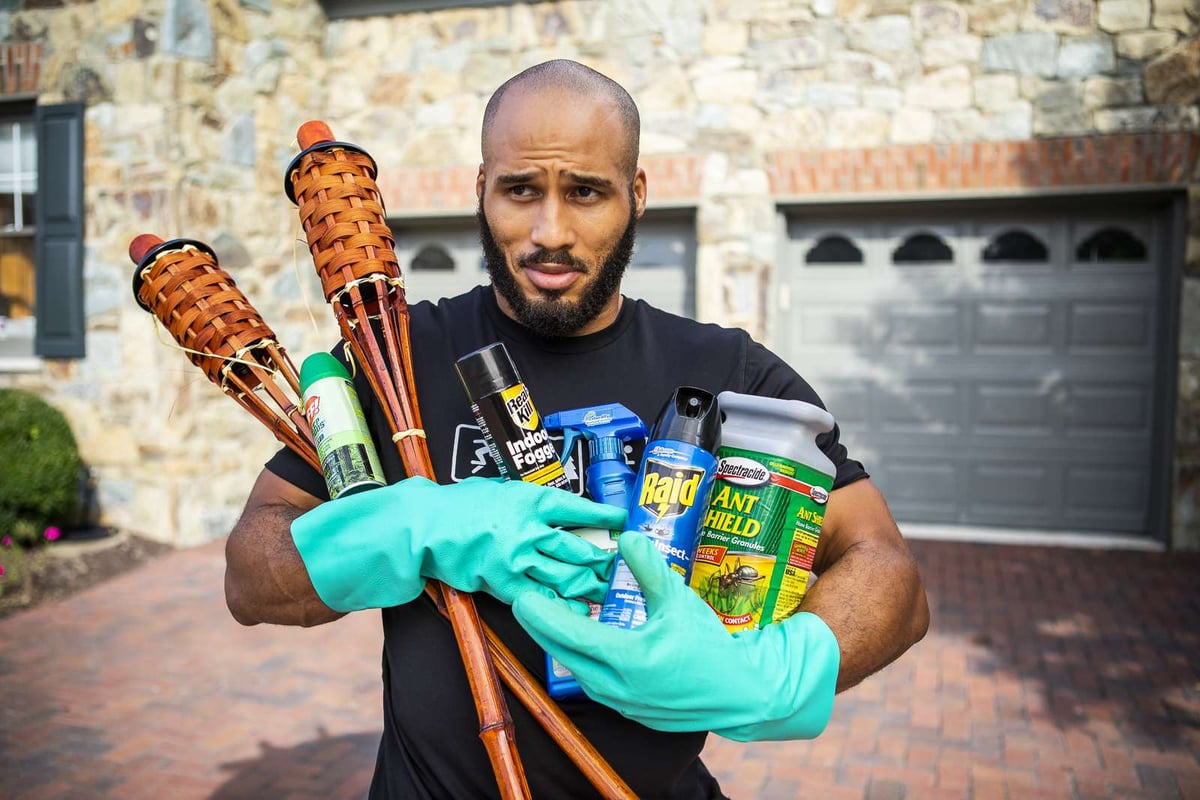 man with DIY pest control products