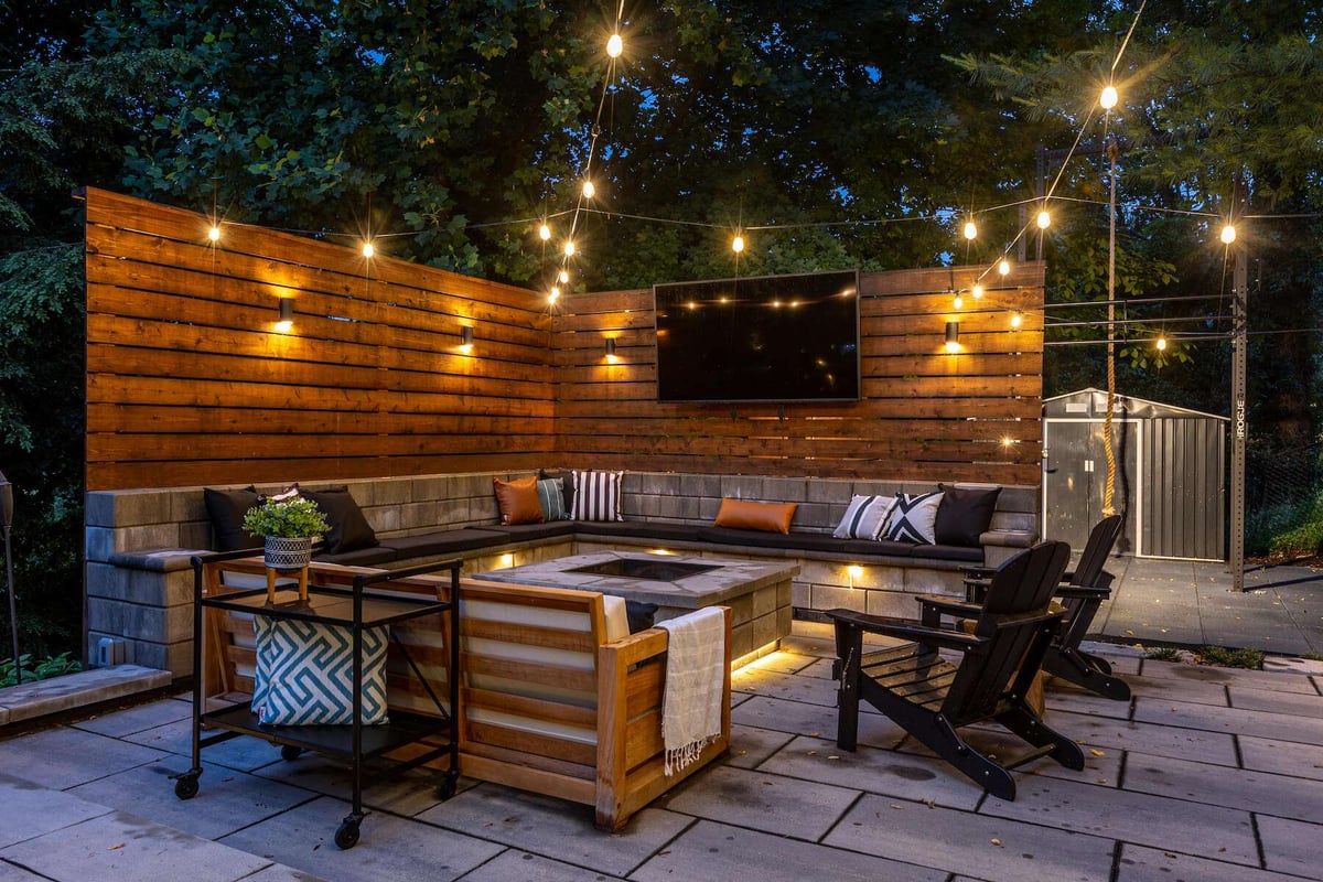 seatwall with firepit and television on wall
