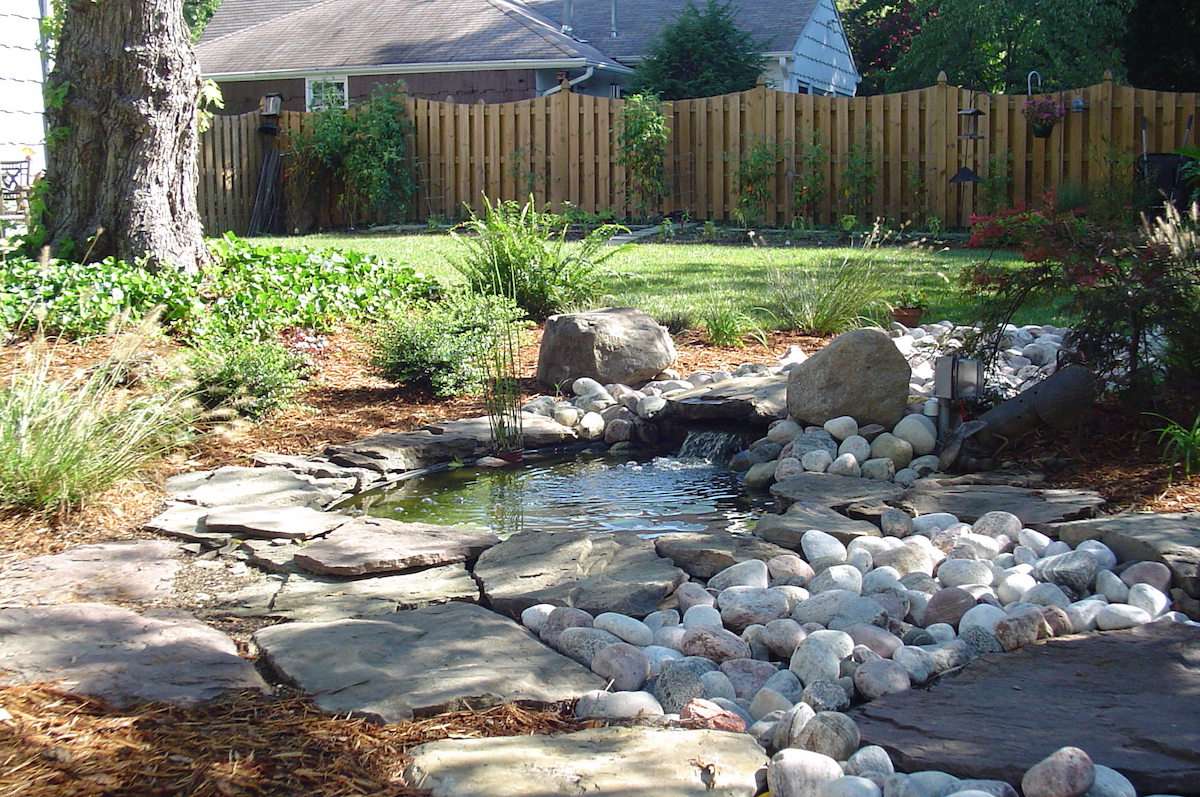 pondless waterfall in backyard landscape