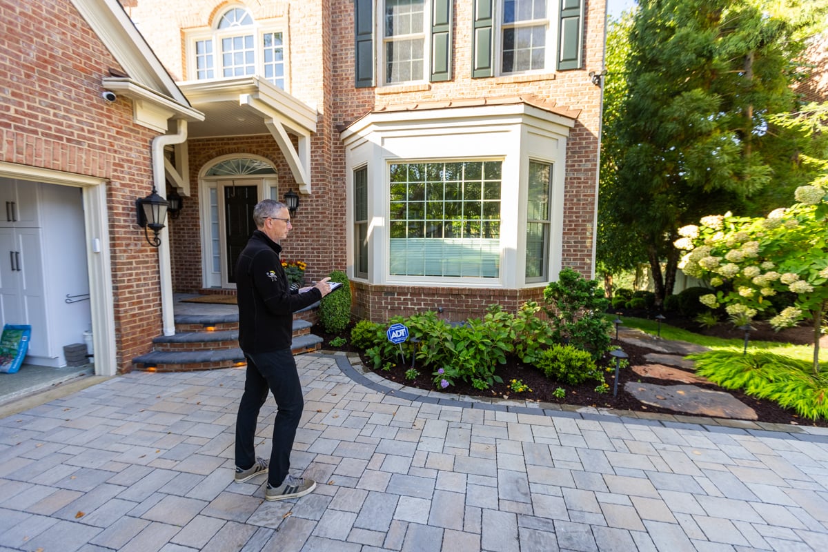 account manager landscape designer inspecting property 5