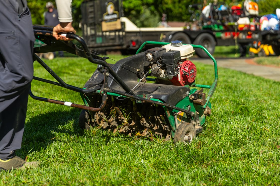 maintenance crew team lawn aeration fall 12