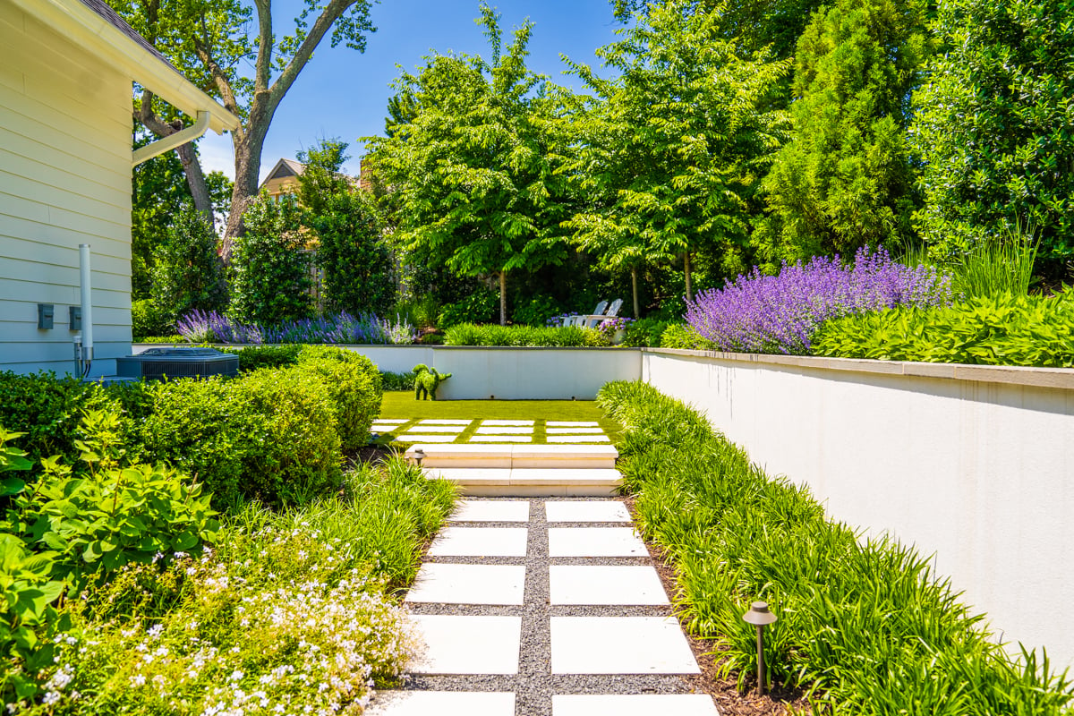 stepping stones walkway set in gravel with border planting beds