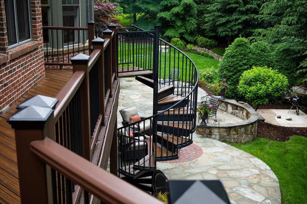 deck designed with spiral staircase to patio