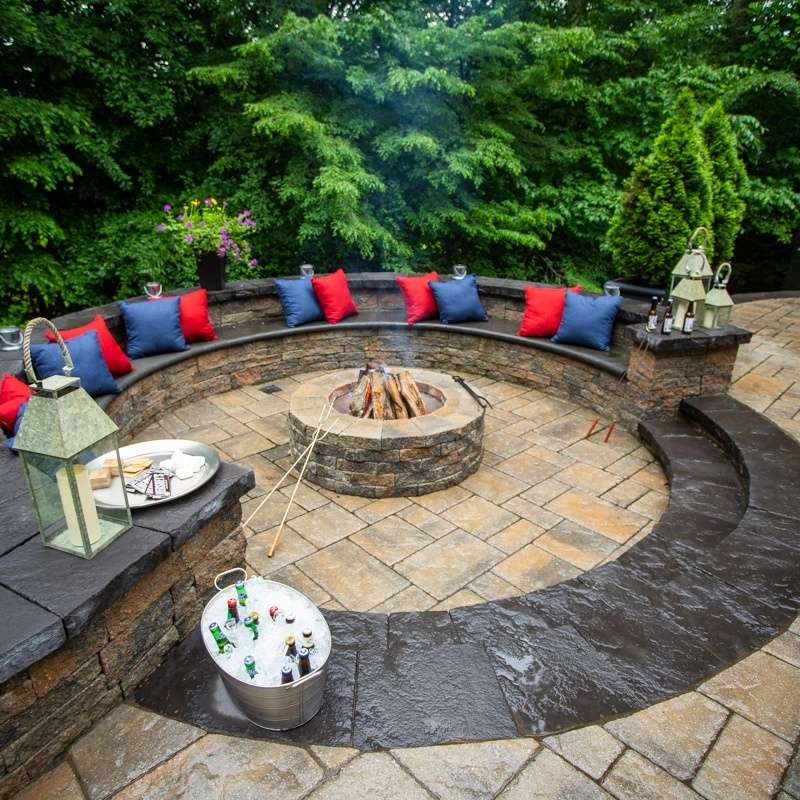 landscape fire pit with seating and pillow cushions