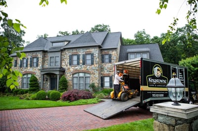 Employee with lawn mowing job for Kingstowne Lawn & Landscape