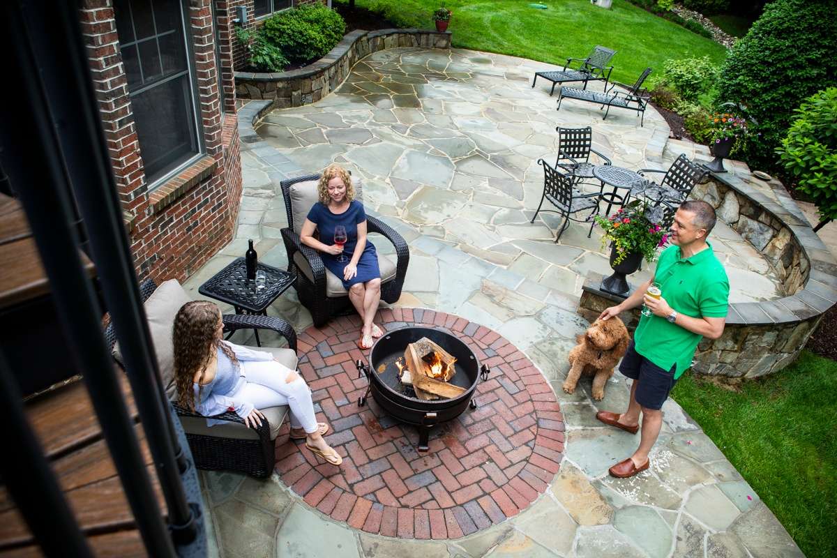 customers enjoying their patio and fire pit