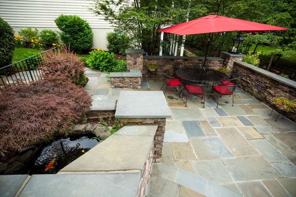 patio dining area with fish pond in Alexandria, VA