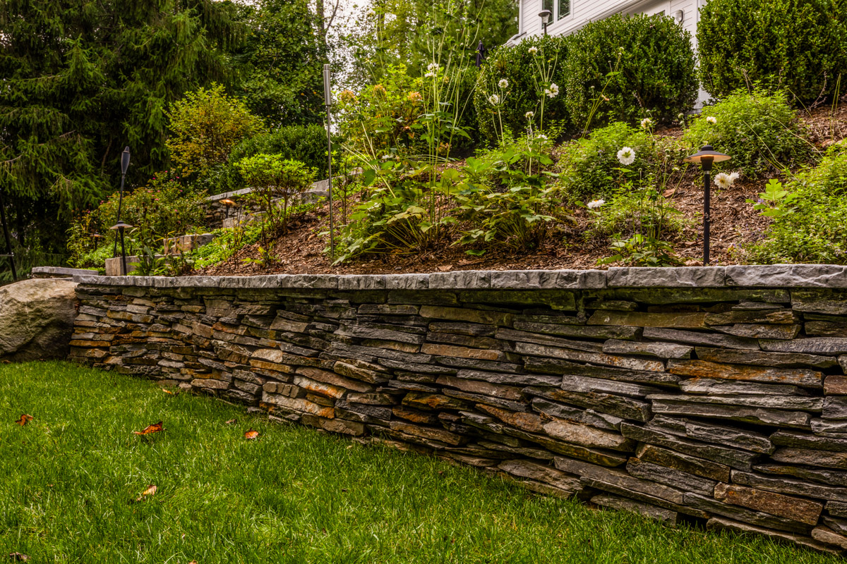natural stone retaining wall in an arlington virginia landscape