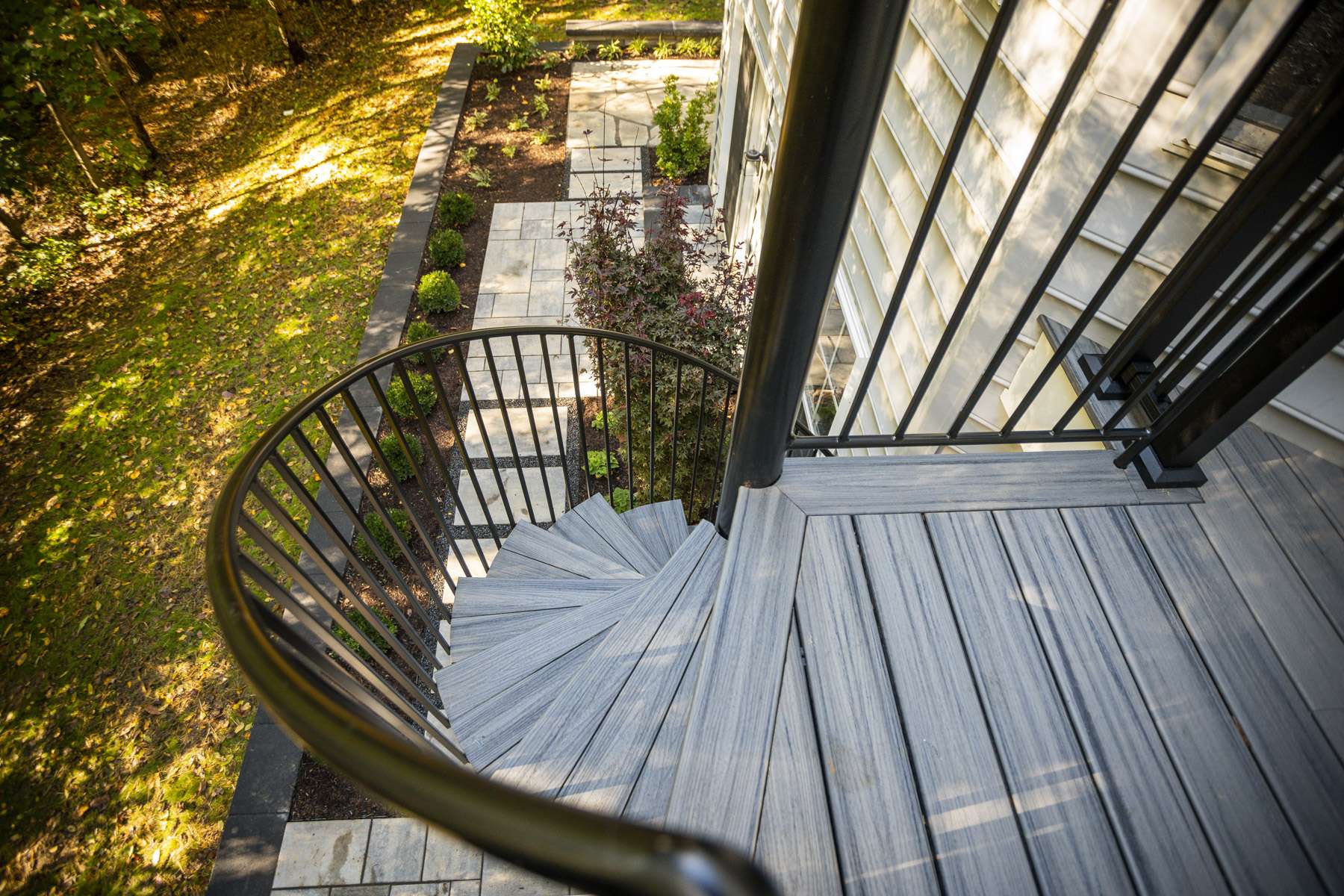 Kingstowne deck spiral staircase paver walkway landscaping 2