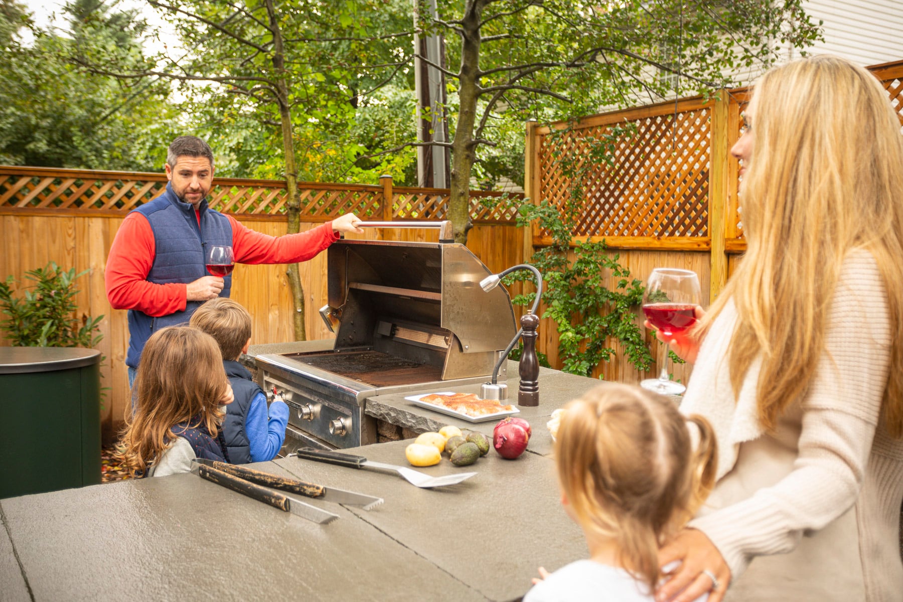family enjoying time outside in a nicely landscaped backyard in alexandria virginia