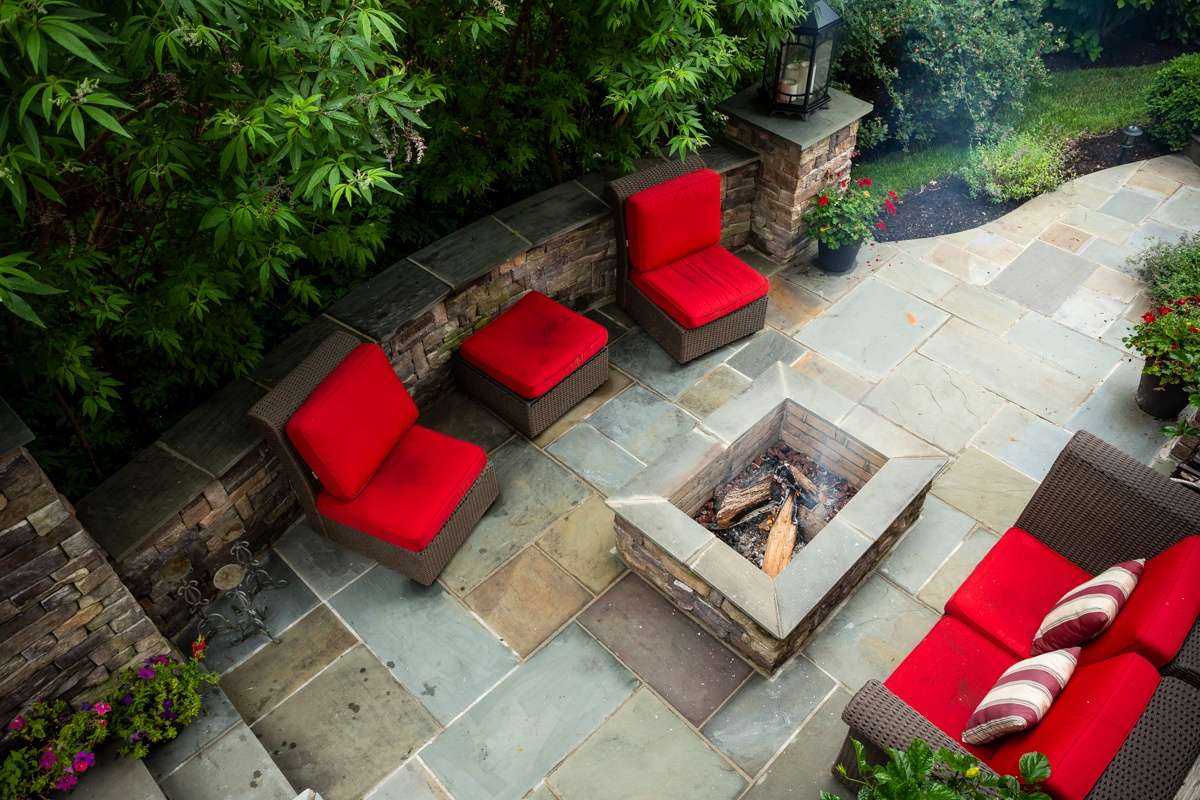 Permanent fire pit with natural stone patio